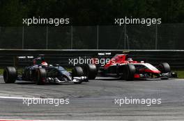 Adrian Sutil (GER) Sauber C33 and Max Chilton (GBR) Marussia F1 Team MR03. 22.06.2014. Formula 1 World Championship, Rd 8, Austrian Grand Prix, Spielberg, Austria, Race Day.