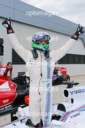 Felipe Massa (BRA) Williams FW36 celebrates his pole position in parc ferme. 21.06.2014. Formula 1 World Championship, Rd 8, Austrian Grand Prix, Spielberg, Austria, Qualifying Day.