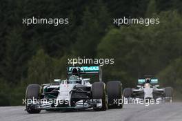 Nico Rosberg (GER) Mercedes AMG F1 W05 leads team mate Lewis Hamilton (GBR) Mercedes AMG F1 W05. 21.06.2014. Formula 1 World Championship, Rd 8, Austrian Grand Prix, Spielberg, Austria, Qualifying Day.