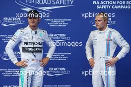 Nico Rosberg (GER) Mercedes AMG F1 W05 and Valtteri Bottas (FIN) Williams FW36. 21.06.2014. Formula 1 World Championship, Rd 8, Austrian Grand Prix, Spielberg, Austria, Qualifying Day.