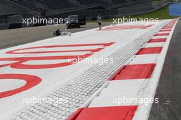 Final circuit preparations. 19.06.2014. Formula 1 World Championship, Rd 8, Austrian Grand Prix, Spielberg, Austria, Preparation Day.