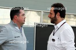 (L to R): Eric Boullier (FRA) McLaren Racing Director with Matteo Bonciani (ITA) FIA Media Delegate. 20.02.2014. Formula One Testing, Bahrain Test One, Day Two, Sakhir, Bahrain.