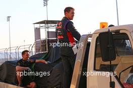 Sebastian Vettel (GER) and his Red Bull Racing RB10 is recovered back to the pits on the back of a truck. 19.02.2014. Formula One Testing, Bahrain Test One, Day One, Sakhir, Bahrain.