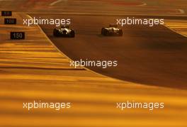 Nico Rosberg (GER), Mercedes AMG F1 Team and Sebastian Vettel (GER), Red Bull Racing  20.02.2014. Formula One Testing, Bahrain Test One, Day Two, Sakhir, Bahrain.