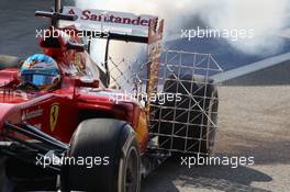 Fernando Alonso (ESP) Ferrari F14-T running sensor equipment and with smoke pouring from the car. 19.02.2014. Formula One Testing, Bahrain Test One, Day One, Sakhir, Bahrain.