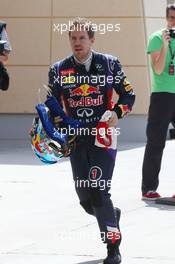 Sebastian Vettel (GER) Red Bull Racing runs back to the pits after stopping on the circuit. 01.03.2014. Formula One Testing, Bahrain Test Two, Day Three, Sakhir, Bahrain.