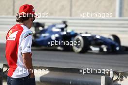 Fernando Alonso (ESP) Ferrari watches former team mate Felipe Massa (BRA) Williams FW36 on the circuit. 01.03.2014. Formula One Testing, Bahrain Test Two, Day Three, Sakhir, Bahrain.