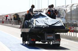 The Red Bull Racing RB10 of Sebastian Vettel (GER) Red Bull Racing is recovered back to the pits on the back of a truck. 02.03.2014. Formula One Testing, Bahrain Test Two, Day Four, Sakhir, Bahrain.
