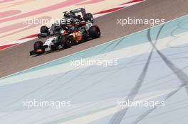 Sergio Perez (MEX) Sahara Force India F1 VJM07 and Nico Rosberg (GER) Mercedes AMG F1 W05. 27.02.2014. Formula One Testing, Bahrain Test Two, Day One, Sakhir, Bahrain.