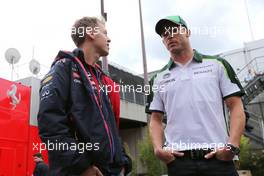 Sebastian Vettel (GER), Red Bull Racing and Andre Lotterer (GER), Caterham F1 Team   22.08.2014. Formula 1 World Championship, Rd 12, Belgian Grand Prix, Spa Francorchamps, Belgium, Practice Day.