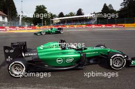 Marcus Ericsson (SWE) Caterham CT05 spins at La Source in FP1 and is passed by team mate Andre Lotterer (GER) Caterham CT05. 22.08.2014. Formula 1 World Championship, Rd 12, Belgian Grand Prix, Spa Francorchamps, Belgium, Practice Day.