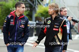 (L to R): Sebastien Buemi (SUI) Red Bull Racing and Scuderia Toro Rosso Reserve Driver with Charles Pic (FRA) Lotus F1 Team Third Driver. 22.08.2014. Formula 1 World Championship, Rd 12, Belgian Grand Prix, Spa Francorchamps, Belgium, Practice Day.