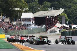 Marcus Ericsson (SWE) Caterham CT05 and Andre Lotterer (GER) Caterham CT05 at the start of the race. 24.08.2014. Formula 1 World Championship, Rd 12, Belgian Grand Prix, Spa Francorchamps, Belgium, Race Day.