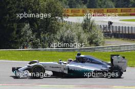 Lewis Hamilton (GBR) Mercedes AMG F1 W05 heads to the pits with a puncture after contact with team mate Nico Rosberg (GER) Mercedes AMG F1. 24.08.2014. Formula 1 World Championship, Rd 12, Belgian Grand Prix, Spa Francorchamps, Belgium, Race Day.