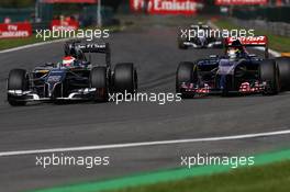 Adrian Sutil (GER) Sauber C33 and Jean-Eric Vergne (FRA) Scuderia Toro Rosso STR9 battle for position. 24.08.2014. Formula 1 World Championship, Rd 12, Belgian Grand Prix, Spa Francorchamps, Belgium, Race Day.