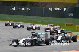 Lewis Hamilton (GBR) Mercedes AMG F1 W05 leads team mate Nico Rosberg (GER) Mercedes AMG F1 W05. 24.08.2014. Formula 1 World Championship, Rd 12, Belgian Grand Prix, Spa Francorchamps, Belgium, Race Day.