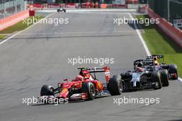 Kimi Raikkonen (FIN), Scuderia Ferrari and Jenson Button (GBR), McLaren F1 Team  24.08.2014. Formula 1 World Championship, Rd 12, Belgian Grand Prix, Spa Francorchamps, Belgium, Race Day.