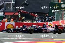 Jean-Eric Vergne (FRA) Scuderia Toro Rosso STR9, Adrian Sutil (GER) Sauber C33 and Daniil Kvyat (RUS) Scuderia Toro Rosso STR9 at the start of the race. 24.08.2014. Formula 1 World Championship, Rd 12, Belgian Grand Prix, Spa Francorchamps, Belgium, Race Day.