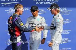(L to R): Sebastian Vettel (GER) Red Bull Racing with Lewis Hamilton (GBR) Mercedes AMG F1 and pole sitter Nico Rosberg (GER) Mercedes AMG F1. 23.08.2014. Formula 1 World Championship, Rd 12, Belgian Grand Prix, Spa Francorchamps, Belgium, Qualifying Day.