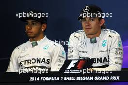 Pole sitter Nico Rosberg (GER) Mercedes AMG F1 (Right) and team mate Lewis Hamilton (GBR) Mercedes AMG F1 in the qualifying FIA Press Conference. 23.08.2014. Formula 1 World Championship, Rd 12, Belgian Grand Prix, Spa Francorchamps, Belgium, Qualifying Day.