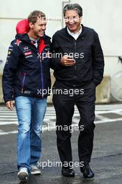 (L to R): Sebastian Vettel (GER) Red Bull Racing with Pasquale Lattuneddu (ITA) of the FOM. 23.08.2014. Formula 1 World Championship, Rd 12, Belgian Grand Prix, Spa Francorchamps, Belgium, Qualifying Day.