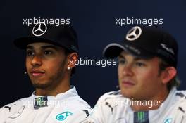 Pole sitter Nico Rosberg (GER) Mercedes AMG F1 (Right) and team mate Lewis Hamilton (GBR) Mercedes AMG F1 in the qualifying FIA Press Conference. 23.08.2014. Formula 1 World Championship, Rd 12, Belgian Grand Prix, Spa Francorchamps, Belgium, Qualifying Day.