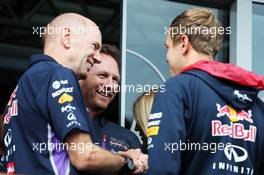 (L to R): Adrian Newey (GBR) Red Bull Racing Chief Technical Officer, Christian Horner (GBR) Red Bull Racing Team Principal and Sebastian Vettel (GER) Red Bull Racing. 23.08.2014. Formula 1 World Championship, Rd 12, Belgian Grand Prix, Spa Francorchamps, Belgium, Qualifying Day.