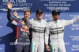 Qualifying top three in parc ferme (L to R): Sebastian Vettel (GER) Red Bull Racing, third; Nico Rosberg (GER) Mercedes AMG F1, pole position; Lewis Hamilton (GBR) Mercedes AMG F1, second. 23.08.2014. Formula 1 World Championship, Rd 12, Belgian Grand Prix, Spa Francorchamps, Belgium, Qualifying Day.