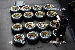 Lotus F1 Team mechanic with Pirelli tyres. 21.08.2014. Formula 1 World Championship, Rd 12, Belgian Grand Prix, Spa Francorchamps, Belgium, Preparation Day.