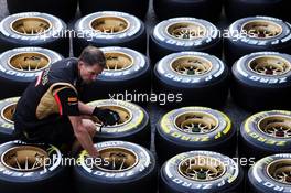 Lotus F1 Team mechanic prepares Pirelli tyres. 21.08.2014. Formula 1 World Championship, Rd 12, Belgian Grand Prix, Spa Francorchamps, Belgium, Preparation Day.