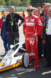 Fernando Alonso (ESP) Ferrari with a car from the Shell Eco Marathon. 21.08.2014. Formula 1 World Championship, Rd 12, Belgian Grand Prix, Spa Francorchamps, Belgium, Preparation Day.