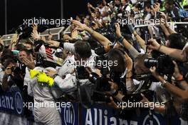 Race winner Lewis Hamilton (GBR) Mercedes AMG F1 celebrates with the team in parc ferme. 06.04.2014. Formula 1 World Championship, Rd 3, Bahrain Grand Prix, Sakhir, Bahrain, Race Day.