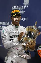 Race winner Lewis Hamilton (GBR) Mercedes AMG F1 celebrates on the podium. 06.04.2014. Formula 1 World Championship, Rd 3, Bahrain Grand Prix, Sakhir, Bahrain, Race Day.