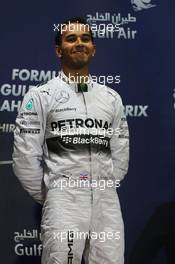 Race winner Lewis Hamilton (GBR) Mercedes AMG F1 celebrates on the podium. 06.04.2014. Formula 1 World Championship, Rd 3, Bahrain Grand Prix, Sakhir, Bahrain, Race Day.