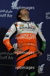 Sergio Perez (MEX) Sahara Force India F1 celebrates his third position on the podium. 06.04.2014. Formula 1 World Championship, Rd 3, Bahrain Grand Prix, Sakhir, Bahrain, Race Day.