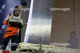 Sergio Perez (MEX) Sahara Force India F1 celebrates his third position on the podium. 06.04.2014. Formula 1 World Championship, Rd 3, Bahrain Grand Prix, Sakhir, Bahrain, Race Day.