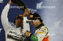 The podium (L to R): Race winner Lewis Hamilton (GBR) Mercedes AMG F1 celebrates with third placed Sergio Perez (MEX) Sahara Force India F1. 06.04.2014. Formula 1 World Championship, Rd 3, Bahrain Grand Prix, Sakhir, Bahrain, Race Day.