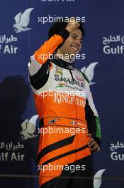 Sergio Perez (MEX) Sahara Force India F1 celebrates his third position on the podium. 06.04.2014. Formula 1 World Championship, Rd 3, Bahrain Grand Prix, Sakhir, Bahrain, Race Day.