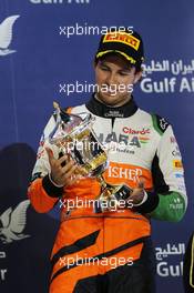 Sergio Perez (MEX) Sahara Force India F1 celebrates his third position on the podium. 06.04.2014. Formula 1 World Championship, Rd 3, Bahrain Grand Prix, Sakhir, Bahrain, Race Day.