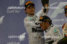 Nico Rosberg (GER) Mercedes AMG F1 and Lewis Hamilton (GBR) Mercedes AMG F1. 06.04.2014. Formula 1 World Championship, Rd 3, Bahrain Grand Prix, Sakhir, Bahrain, Race Day.