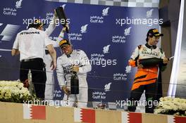 Race winner Lewis Hamilton (GBR) Mercedes AMG F1 celebrates on the podium. 06.04.2014. Formula 1 World Championship, Rd 3, Bahrain Grand Prix, Sakhir, Bahrain, Race Day.