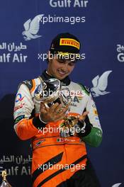 Sergio Perez (MEX) Sahara Force India F1 celebrates his third position on the podium. 06.04.2014. Formula 1 World Championship, Rd 3, Bahrain Grand Prix, Sakhir, Bahrain, Race Day.