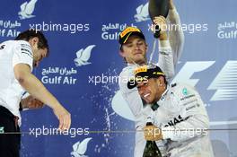 The podium (L to R): second placed Nico Rosberg (GER) Mercedes AMG F1 celebrates with race winning team mate Lewis Hamilton (GBR) Mercedes AMG F1. 06.04.2014. Formula 1 World Championship, Rd 3, Bahrain Grand Prix, Sakhir, Bahrain, Race Day.