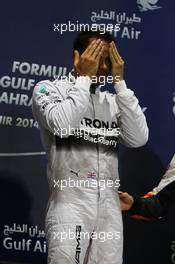 Race winner Lewis Hamilton (GBR) Mercedes AMG F1 on the podium. 06.04.2014. Formula 1 World Championship, Rd 3, Bahrain Grand Prix, Sakhir, Bahrain, Race Day.