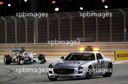 Lewis Hamilton (GBR) Mercedes AMG F1 W05 leads behind the FIA Safety Car. 06.04.2014. Formula 1 World Championship, Rd 3, Bahrain Grand Prix, Sakhir, Bahrain, Race Day.