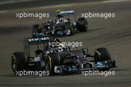 Lewis Hamilton (GBR) Mercedes AMG F1 W05 leads Nico Rosberg (GER) Mercedes AMG F1 W05. 06.04.2014. Formula 1 World Championship, Rd 3, Bahrain Grand Prix, Sakhir, Bahrain, Race Day.