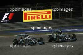 (L to R): Lewis Hamilton (GBR) Mercedes AMG F1 W05 and team mate Nico Rosberg (GER) Mercedes AMG F1 W05 battle for position. 06.04.2014. Formula 1 World Championship, Rd 3, Bahrain Grand Prix, Sakhir, Bahrain, Race Day.
