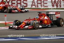 Fernando Alonso (ESP), Scuderia Ferrari and Kimi Raikkonen (FIN), Scuderia Ferrari  06.04.2014. Formula 1 World Championship, Rd 3, Bahrain Grand Prix, Sakhir, Bahrain, Race Day.