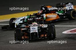 Sergio Perez (MEX) Sahara Force India F1 VJM07 leads team mate Nico Rosberg (GER) Mercedes AMG F1 W05. 06.04.2014. Formula 1 World Championship, Rd 3, Bahrain Grand Prix, Sakhir, Bahrain, Race Day.