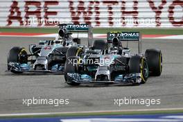 Lewis Hamilton (GBR), Mercedes AMG F1 Team and Nico Rosberg (GER), Mercedes AMG F1 Team  06.04.2014. Formula 1 World Championship, Rd 3, Bahrain Grand Prix, Sakhir, Bahrain, Race Day.